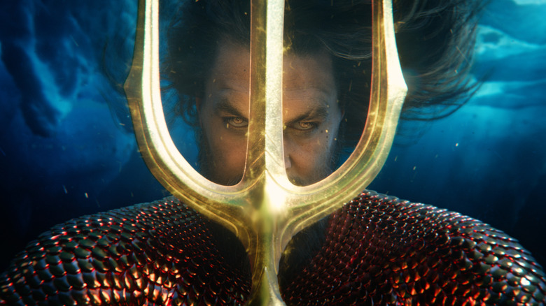 Aquaman holding trident underwater