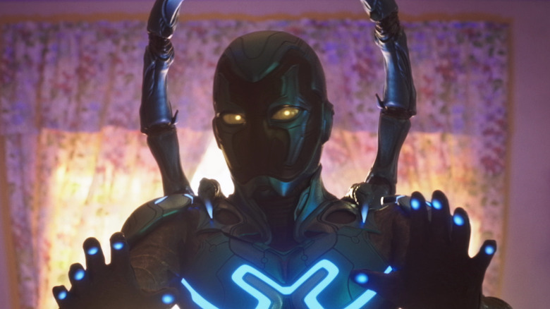 Blue Beetle raises his hands