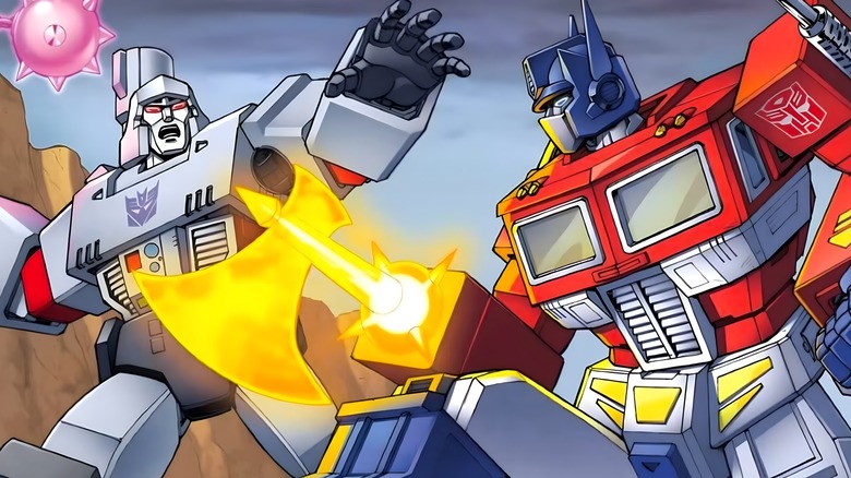 Optimus Prime uses axe on Megatron