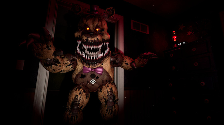 The transformed animatronic attacking with a wide toothy smile