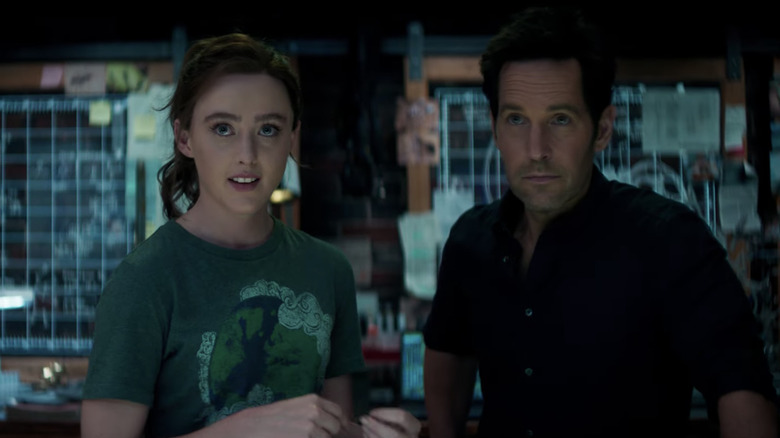 Cassie Lang and Scott Lang stand beside the device