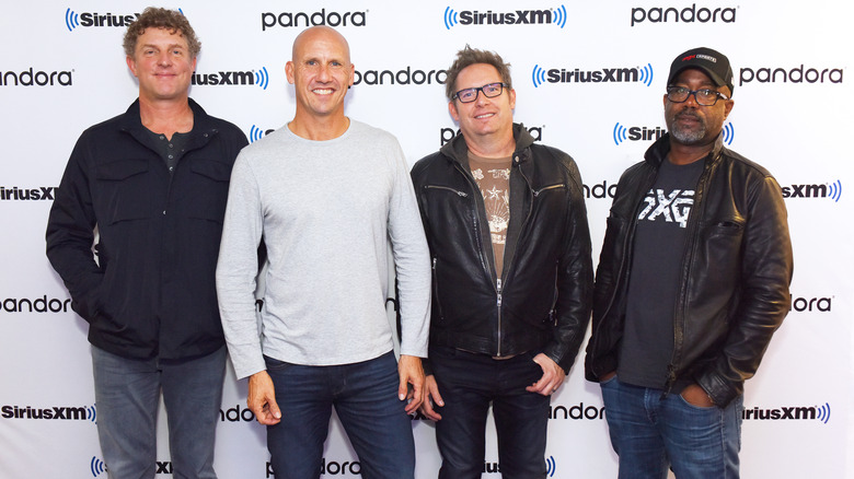 Hootie and the Blowfish band smiling at public event