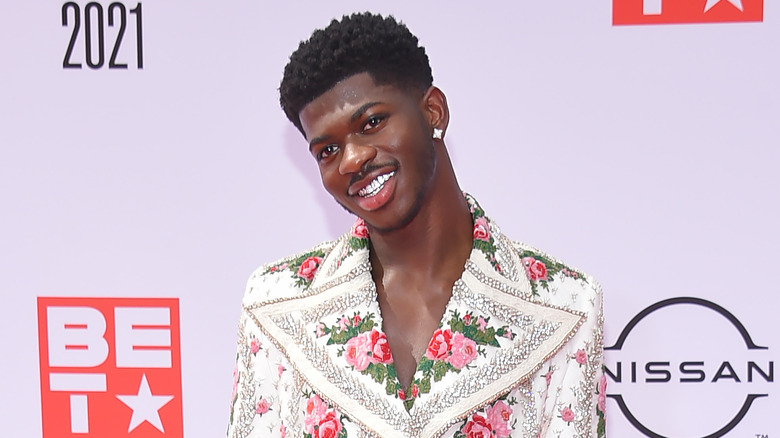 Lil Nas X wears flower suit on red carpet