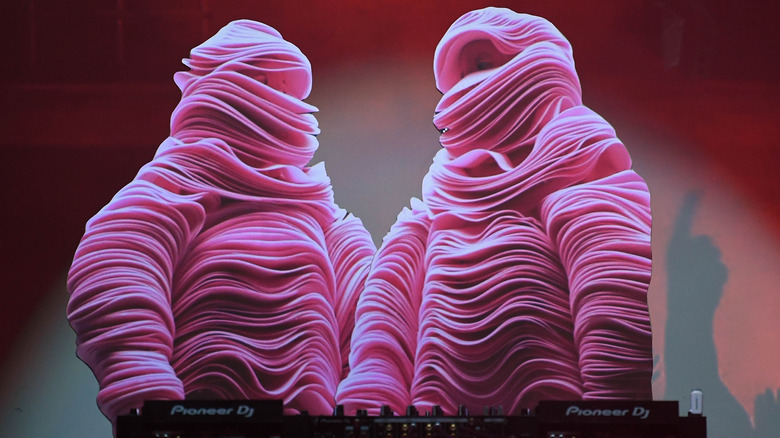 The Chemical Brothers in pink costumes