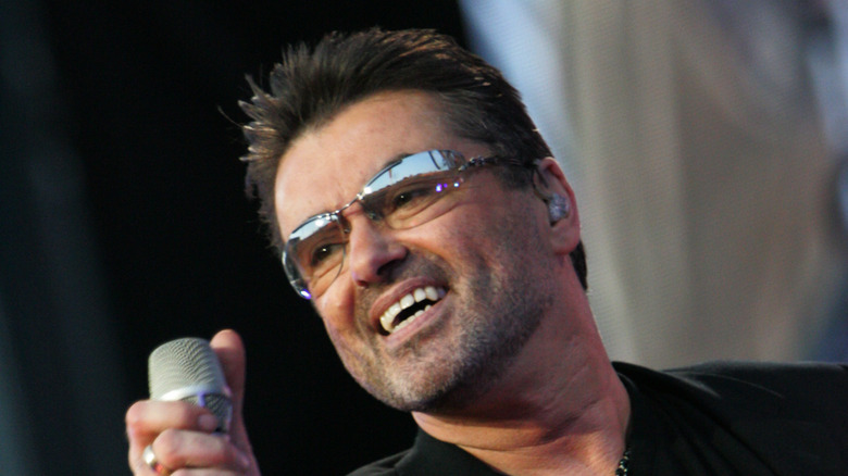 George Michael holding mic