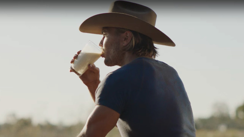 Farmer enjoying almond milk