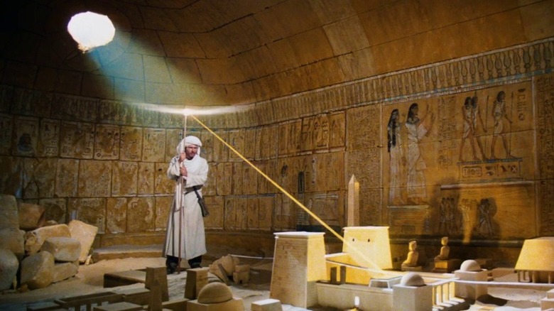 Indiana Jones using the sun to find the ark