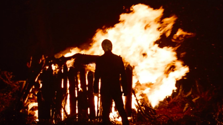 Luke Skywalker standing at fire