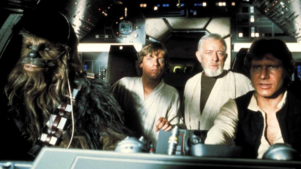 Alec Guinness, Mark Hamill, and Harrison Ford in Star Wars