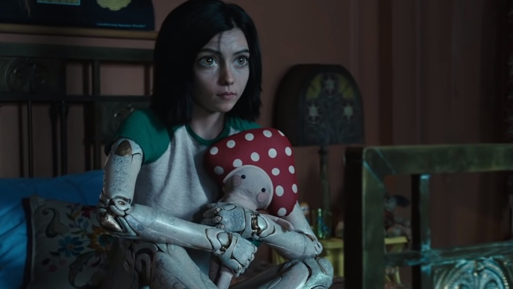 Alita holding a stuffed animal