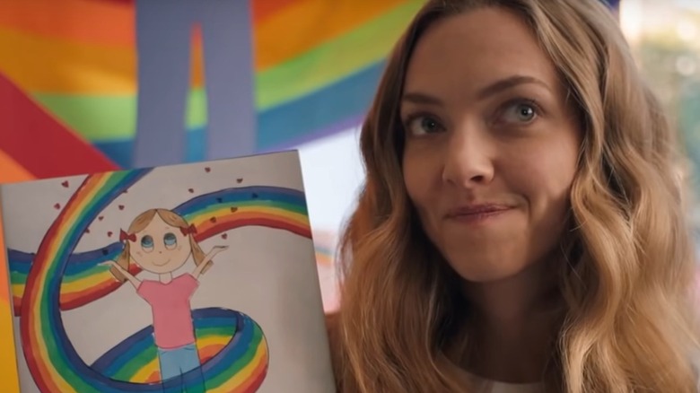 Julie holding up book