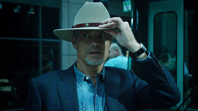 Raylan adjusts his hat nervously