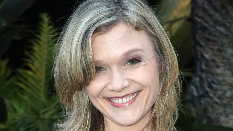 ECU of Ariana Richards smiling and tilting head