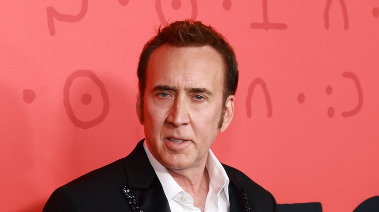 Nicolas Cage black suit sideburns