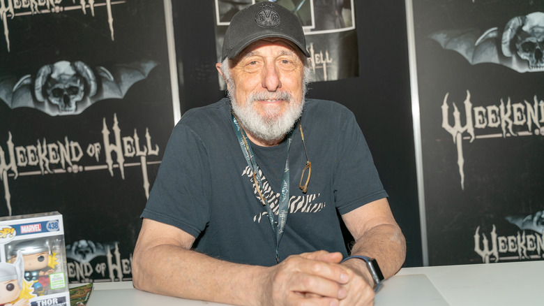 Nick Castle sitting at a table