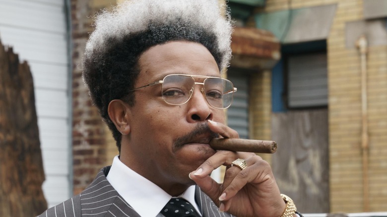 Russell Hornsby smokes a cigar as Don King in "Mike"