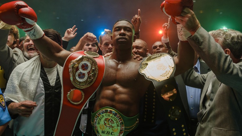 Trevante Rhodes wears championship belts as Mike Tyson in "Mike"