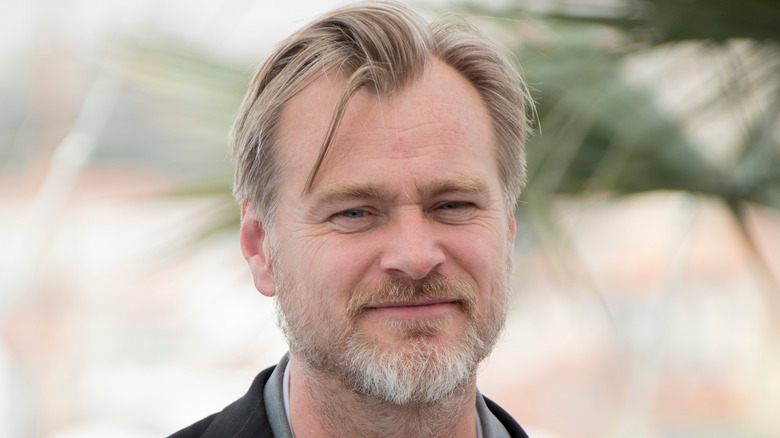 Christopher Nolan smiling subtly 