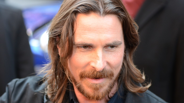 Christian Bale with long hair and beard