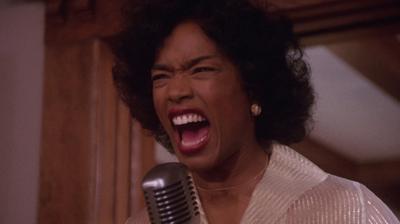 Angela Bassett wailing into microphone