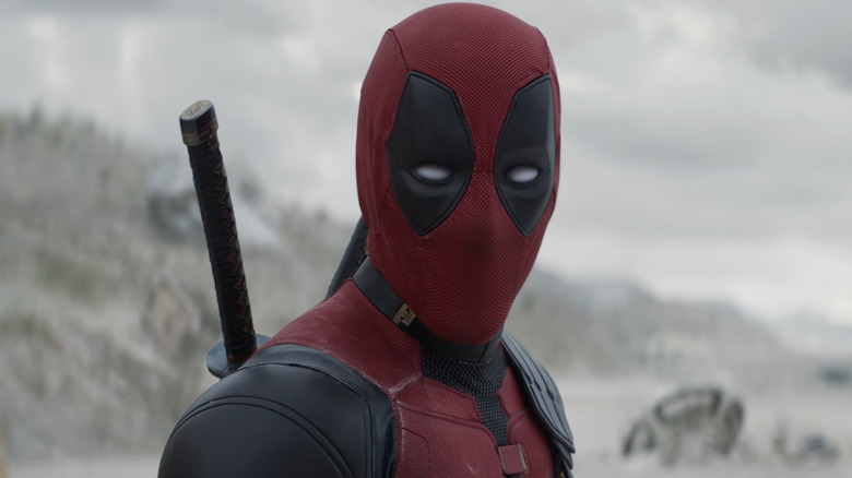 Deadpool looking on