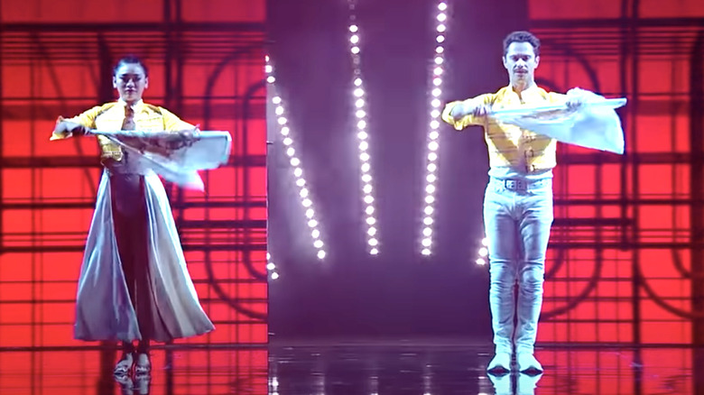 Suni Lee, Sasha Farber dancing with flags