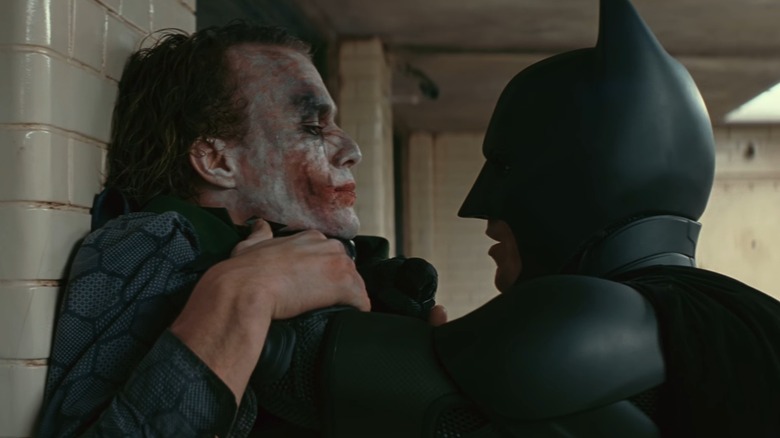 Batman choking Joker