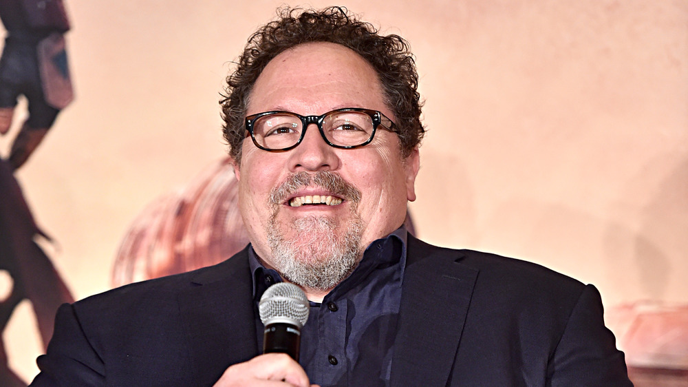 Jon Favreau holding mic