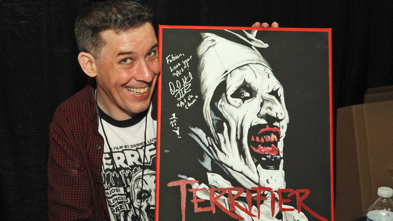 David Howard Thornton holding a fan made picture of Terrifier