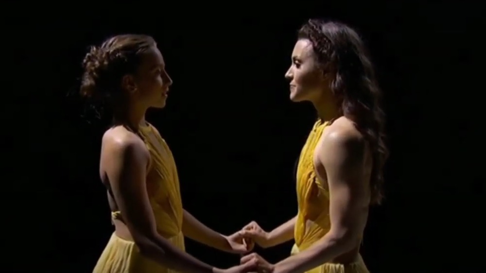 Tate McRae and Kathryn McCormick holding hands