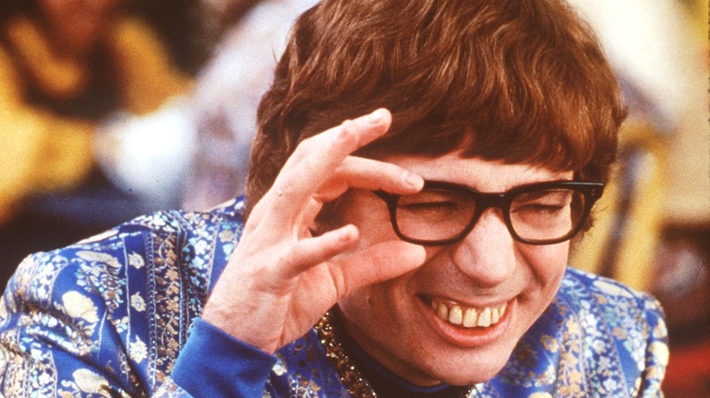 Austin Powers holding glasses