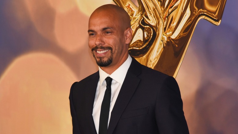 Bryton James smiles at a red carpet event