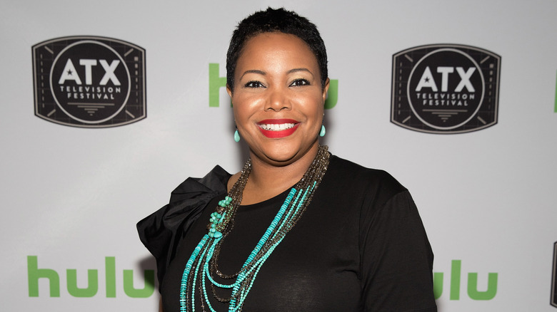 Kellie Williams smiles at a red carpet event