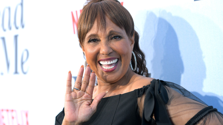 Telma Hopkins smiles at a red carpet event