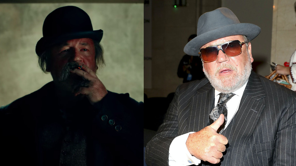 Ray Winstone in Hugo and wearing a suit and hat in 2020