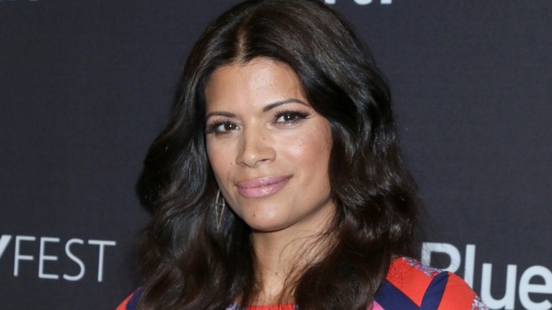 Andrea Navedo smirking 