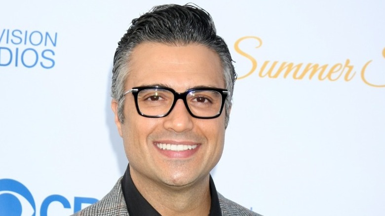 Jaime Camil smiling in glasses