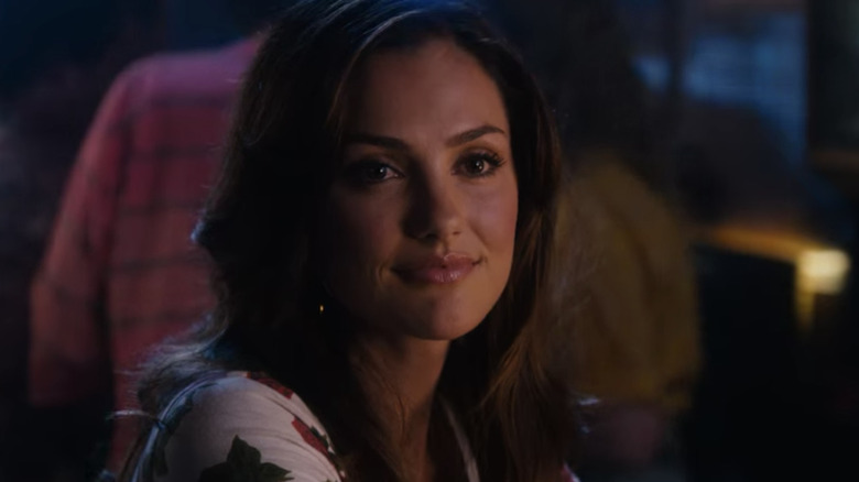 Minka Kelly in moody lighting