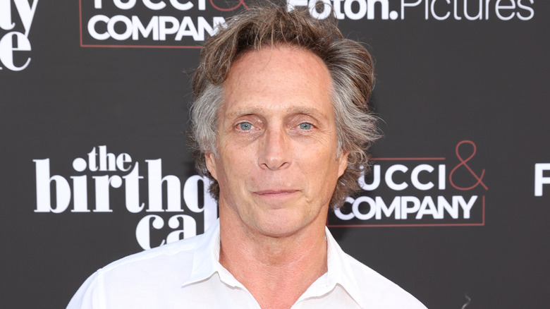 William Fichtner close-lipped smile at camera