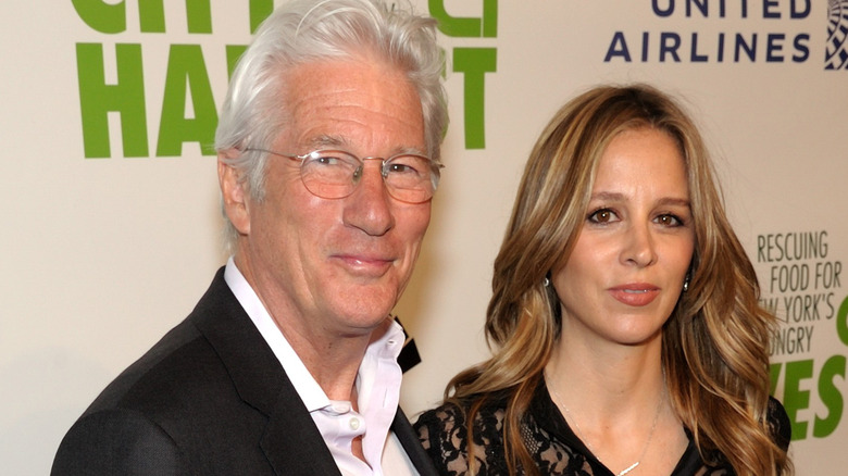 Richard Gere smirking and Alejandra Silva staring