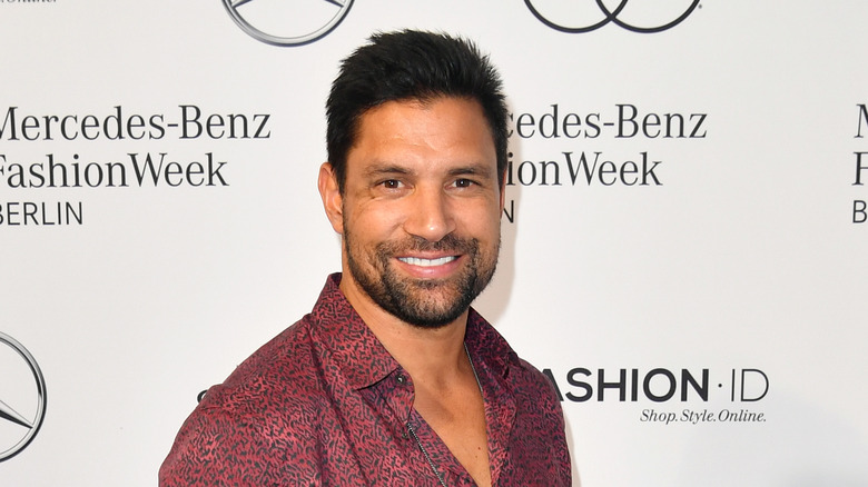 Manu Bennett smiles