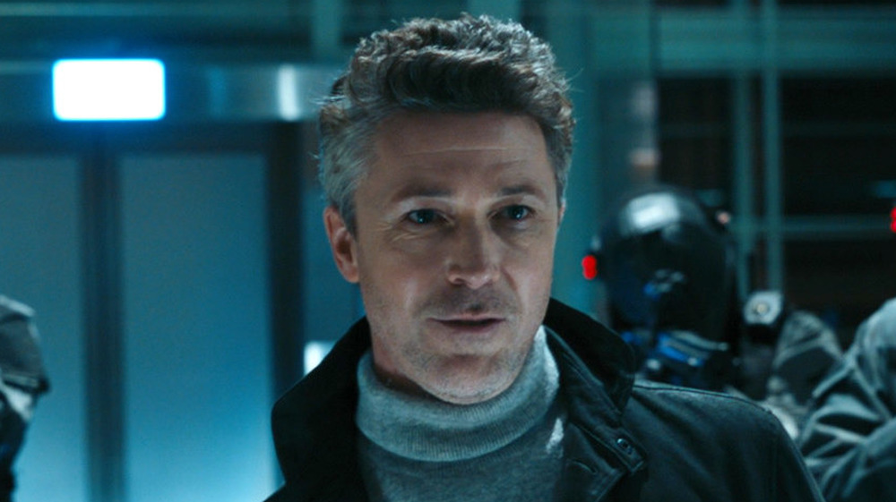 Aidan Gillen's Janson smirks