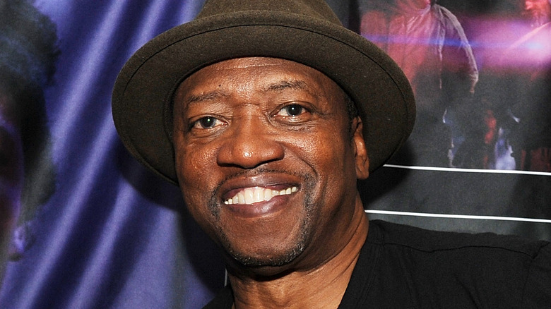 T.K. Carter smiling in hat