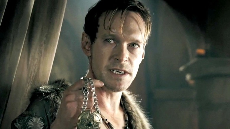 Steven Mackintosh holds up chain