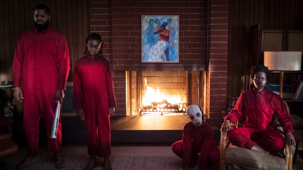 Lupita Nyong'o as Red, together with her Tethered family, in Us