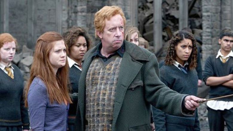 Arthur Weasley holding wand