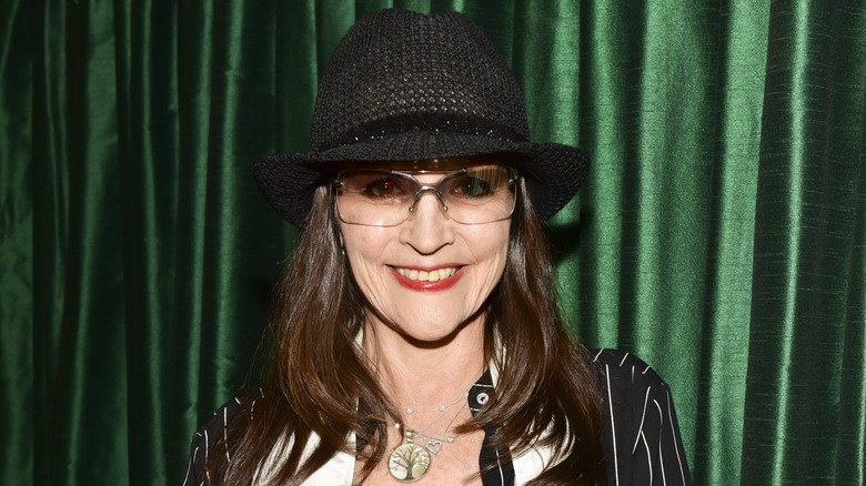 Olivia Hussey smiling in hat