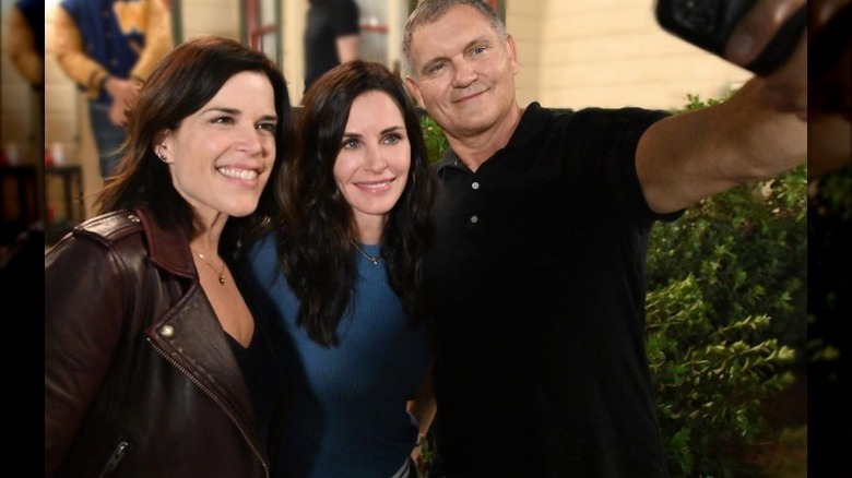 Neve Campbell poses with Courtney Cox and Kevin Williamson