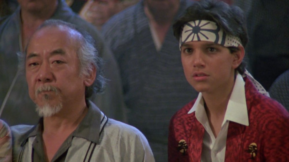 Mr. Miyagi (Pat Morita) teaching Daniel LaRusso (Ralph Macchio) in The Karate Kid Part II