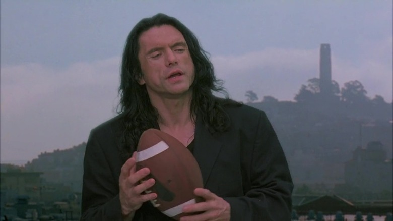 Johnny holding a football